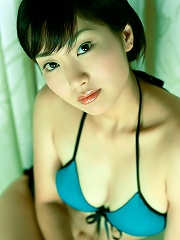 Alluring asian doll has a set of perky petite tits in a bikini