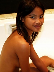 Sweet and sexy Asian teen has a good time in the bathtub